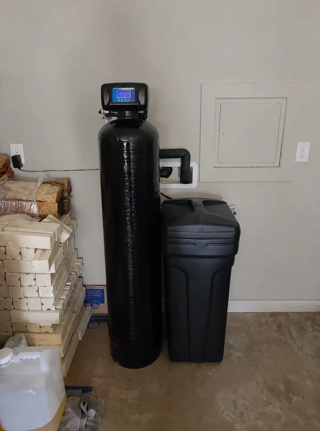 Water softener with digital control valve and brine tank installed in a utility room in Wilmington, DE